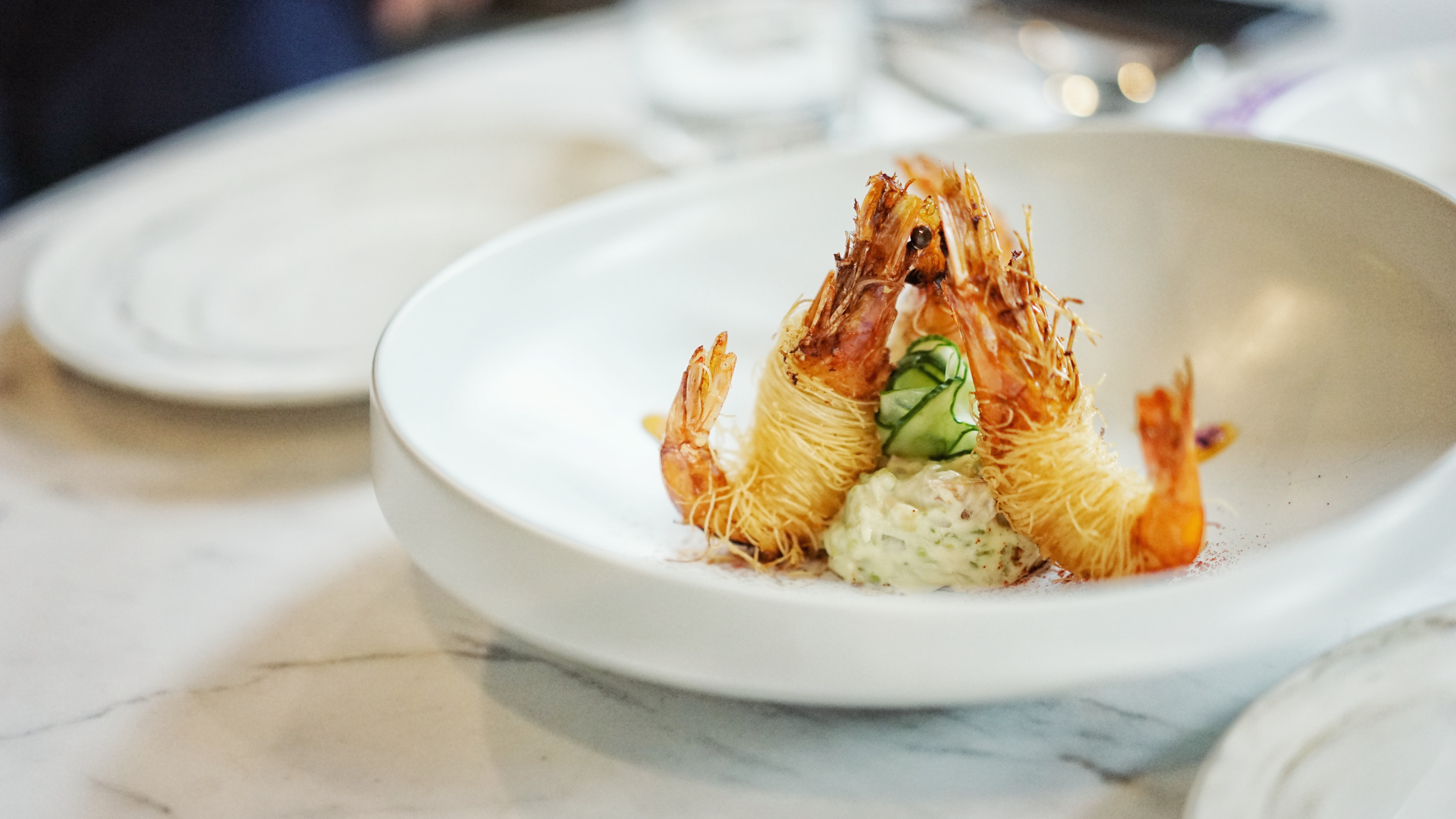 shrimp noodles in a white plate